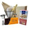 Locker Zubehör für spanische Churros, inklusive Schokolade, Backpapier, Becher, Zucker, und Fett, direkt aus Spanien für authentisches Nascherlebnis.