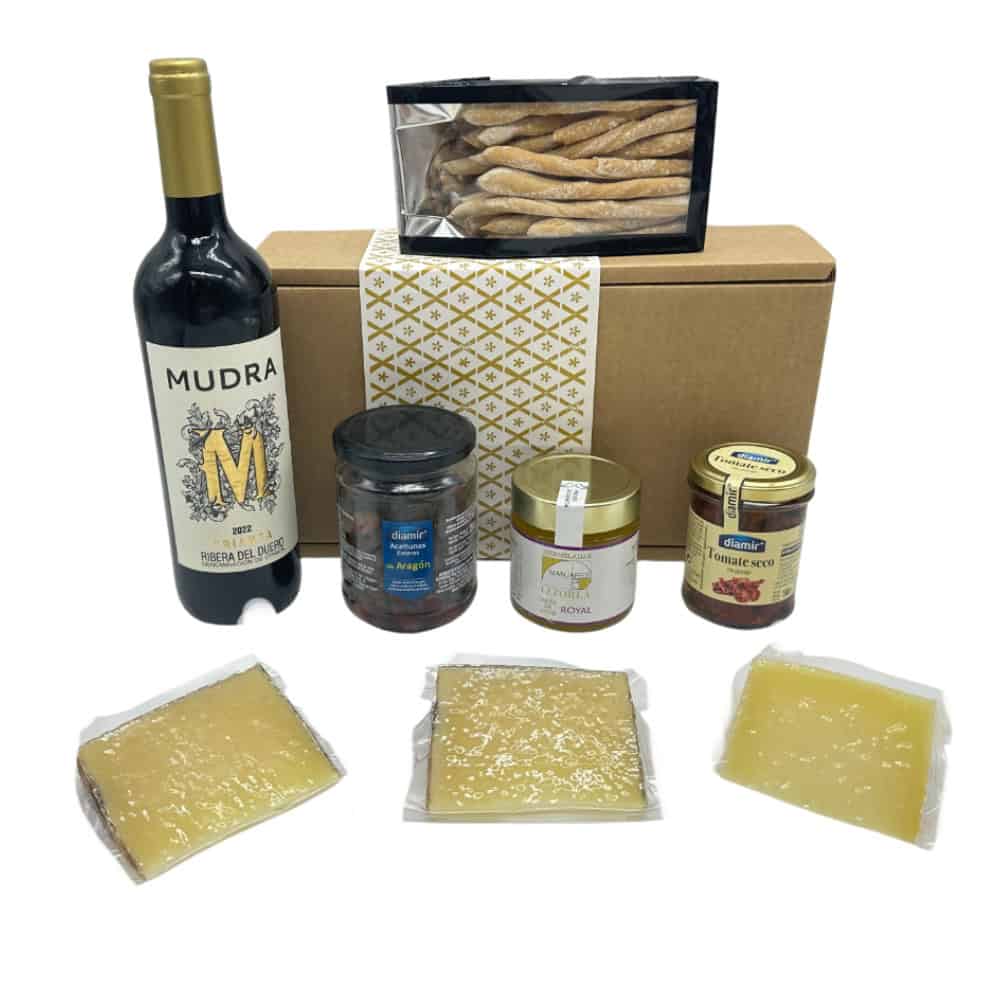 Feinschmecker Geschenkbox mit spanischen Köstlichkeiten, including Wein, Käse, Trockenfleisch und Getrocknete Tomaten, perfekt für kulinarische Geschenke aus Spanien.