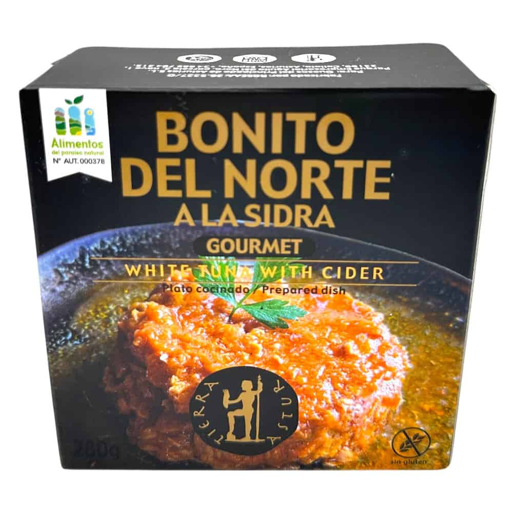 Spanischer Bonito del Norte in Sidra, 280 g, mit frischer Zitrone und grüner Minze, auf einer schwarzen Verpackung.