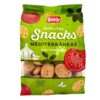 Quely Mediterraneansnacks in grüner Verpackung mit Tomaten, Knoblauch und mediterranen Kräutern, ideal für mediterrane Häppchen.